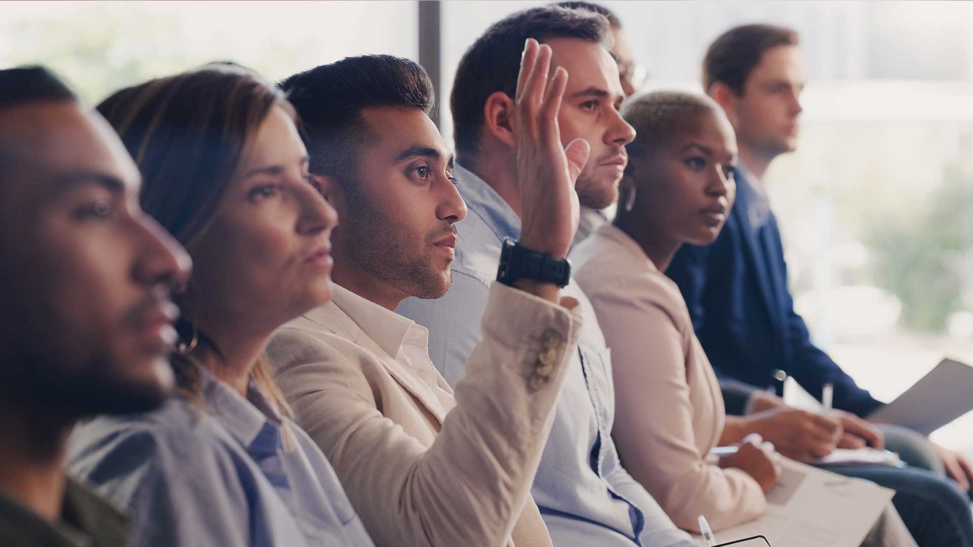Individual Raising Their Hand